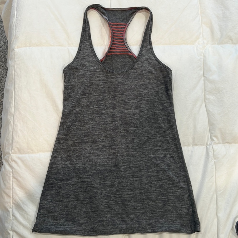 Gray Lululemon racerback tank with pink ruffle detail